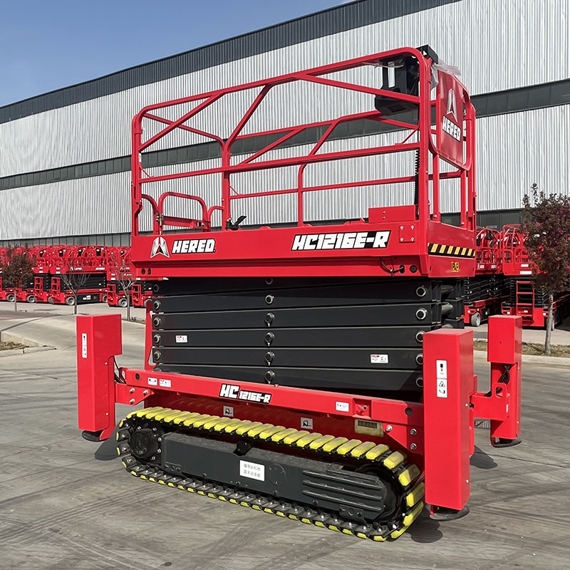 Red HERED HC1216ER crawler scissor lift in stowed position with outriggers