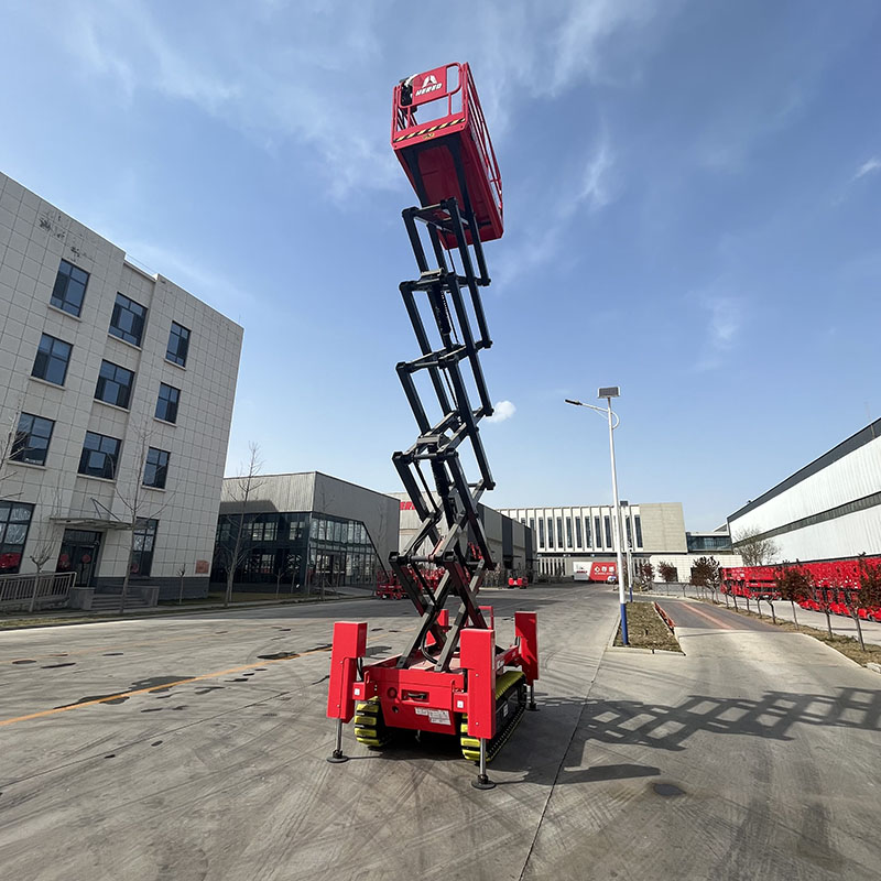 Red HERED HC1216ER crawler scissor lift in stowed position with outriggers