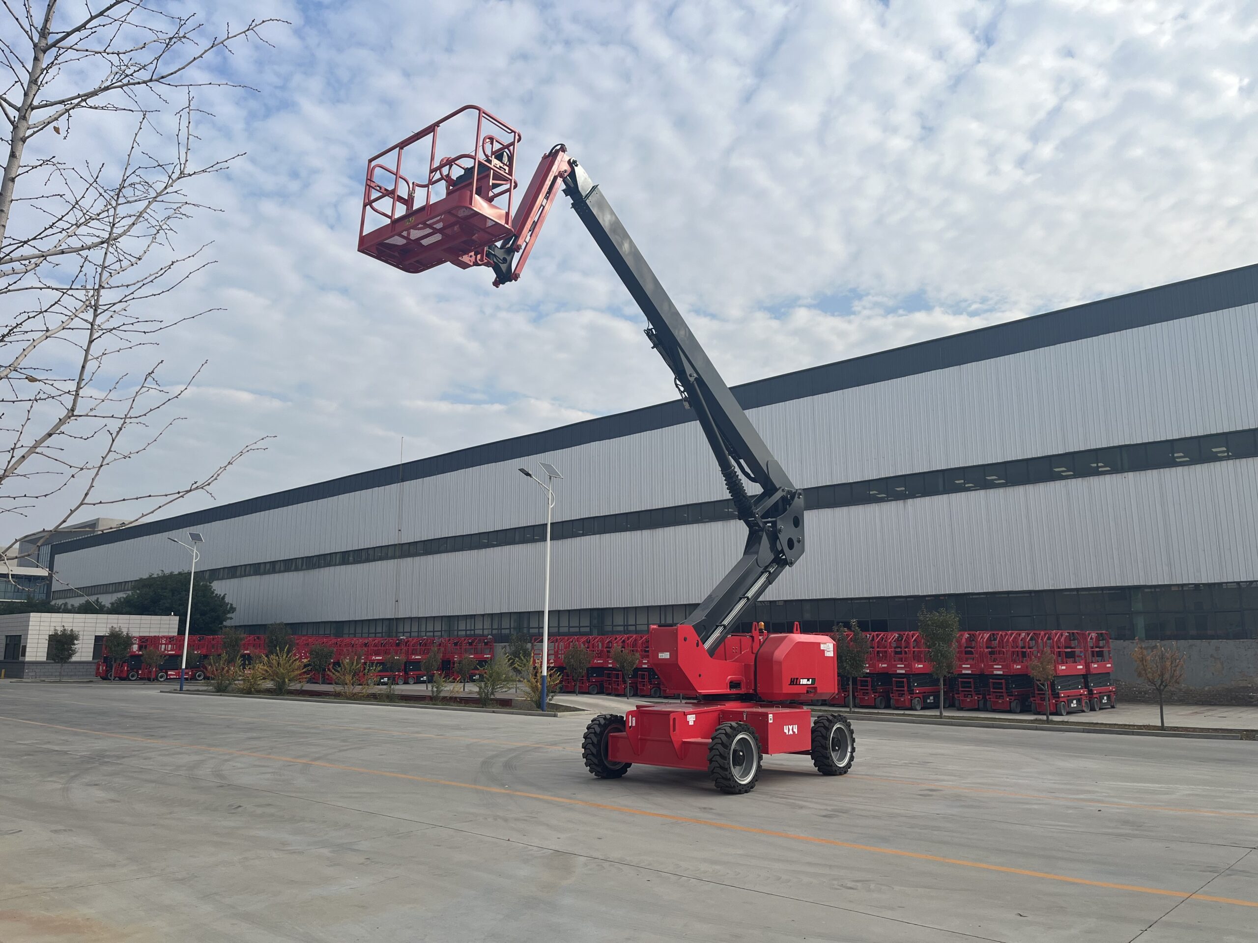 Red HERED HT18JE telescopic boom lift in stowed position