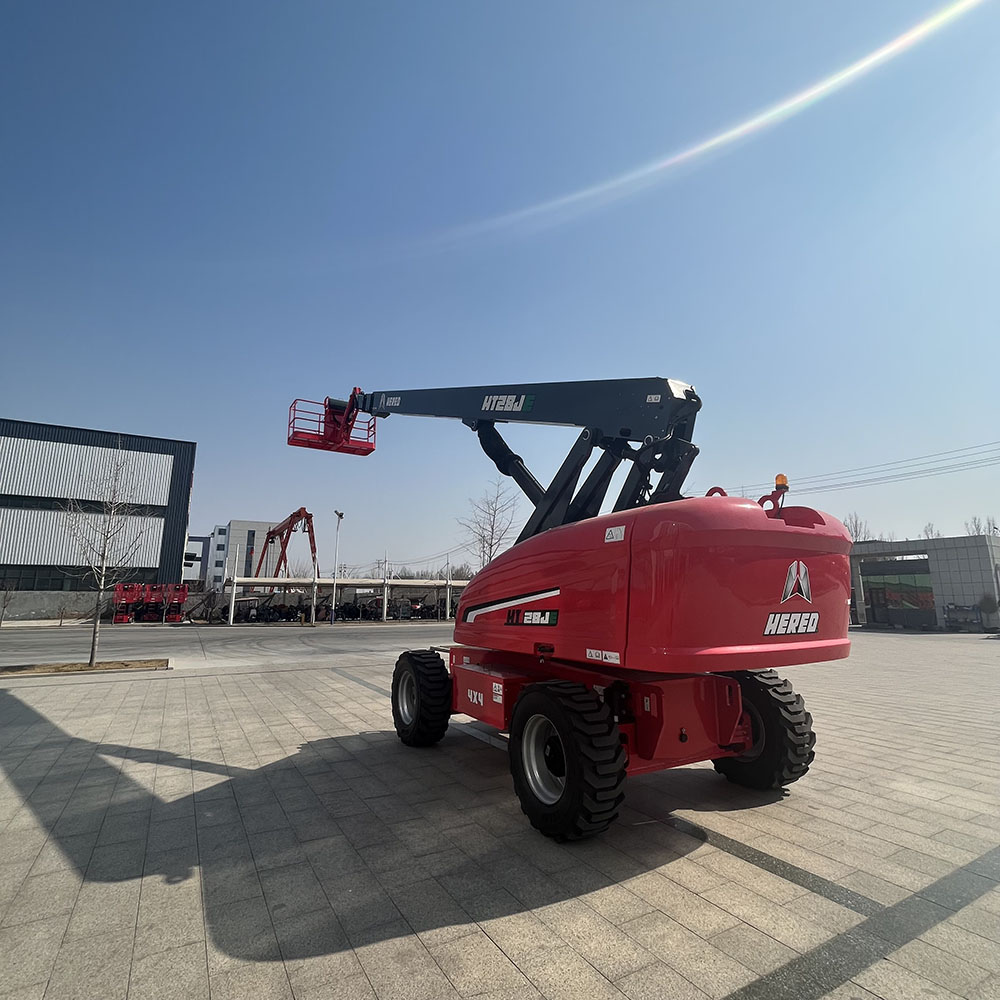 Red HERED HT26JE telescopic boom lift in stowed position